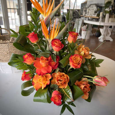 Tropical bouquet with orange bird of paradise and orange-red roses
