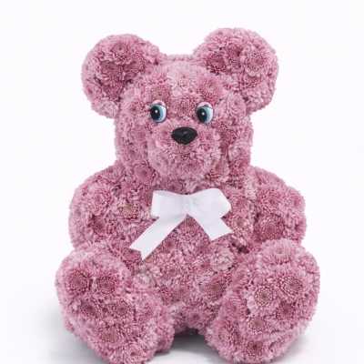 Pink flower teddy bear with a white bow
