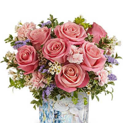 Pink roses arranged in a decorated glass vase