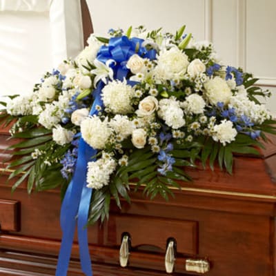 Blue and white casket spray