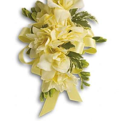 Yellow floral wrist corsage with ribbon and greenery