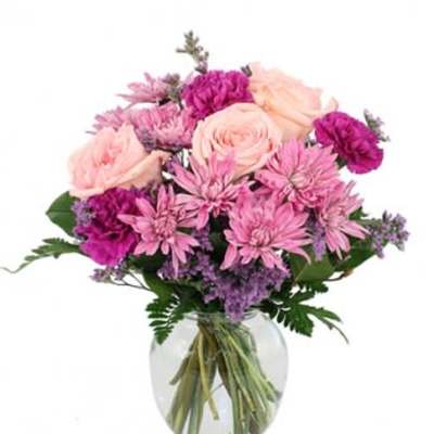 Pink and purple bouquet in a clear glass vase