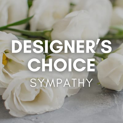 White roses with overlaid text reading Designer's Choice Sympathy