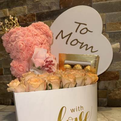Pink rose teddy bear gift set with roses, chocolates, and a "To Mom" sign