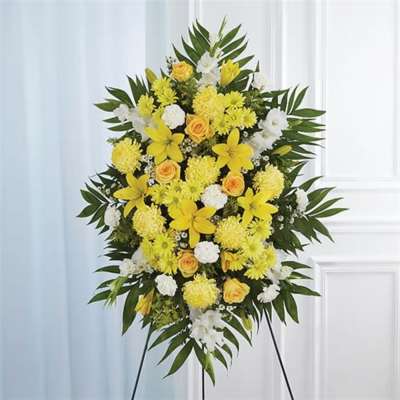 Yellow and white floral standing spray on an easel