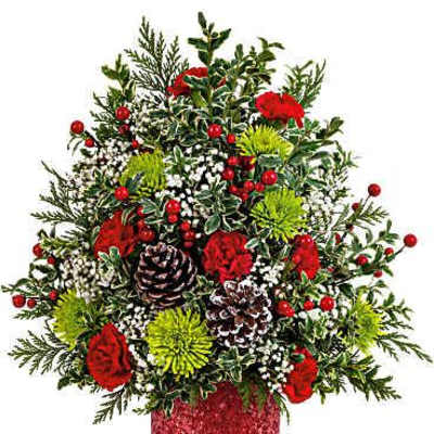 Holiday arrangement with red flowers, pinecones, and berries in a red vase