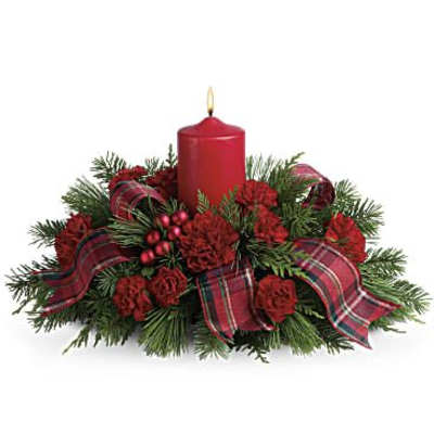 Red candle centerpiece with evergreen and plaid ribbon
