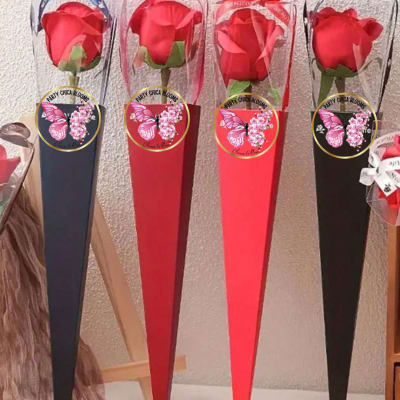 Single red rose in a tall cone wrap