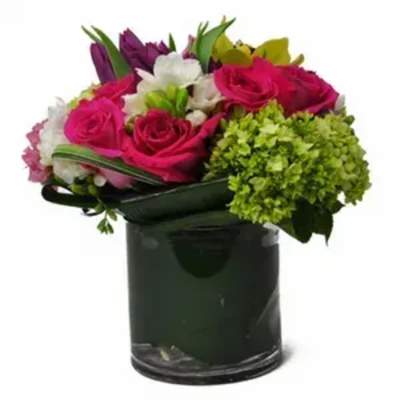 Bouquet of pink and white flowers in a dark glass vase