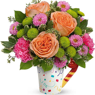Bouquet of peach roses and pink flowers in a confetti cup with a party horn