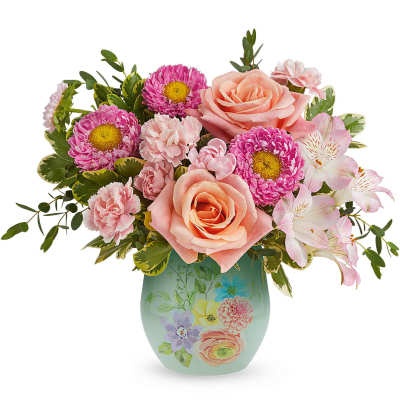 Pink roses and daisies arranged in a painted vase