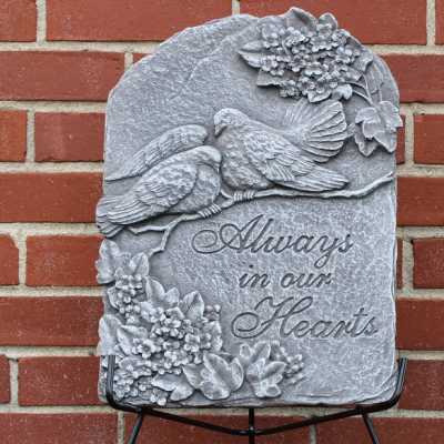 Gray memorial plaque with two birds and the words "Always in our Hearts"