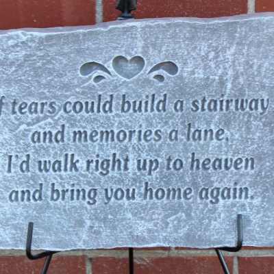 Stone memorial plaque with an engraved sympathy verse