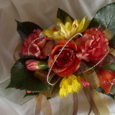 Colorful bouquet with red, pink, and yellow flowers tied with ribbon