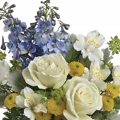 Bouquet of white roses, blue flowers, and white alstroemeria