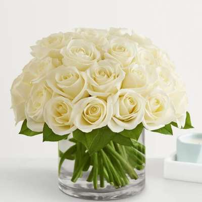 White rose bouquet in a clear glass vase