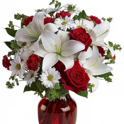 Bouquet of red roses, white lilies, and daisies in a red vase