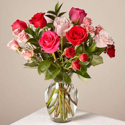 Spray Rose's with Rose's in a vase
