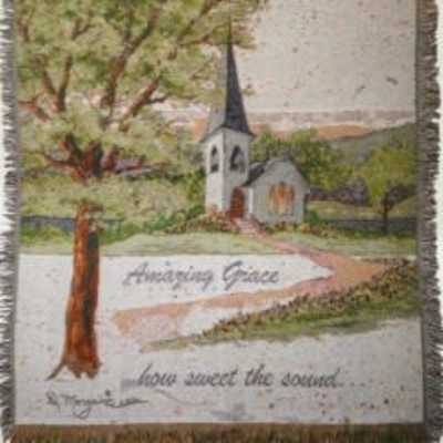Framed landscape print of a church and tree with the words "Amazing Grace"