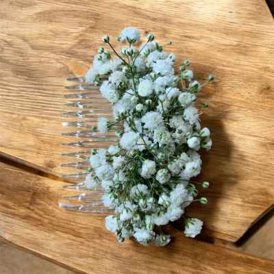 White floral hair comb with small clustered blooms