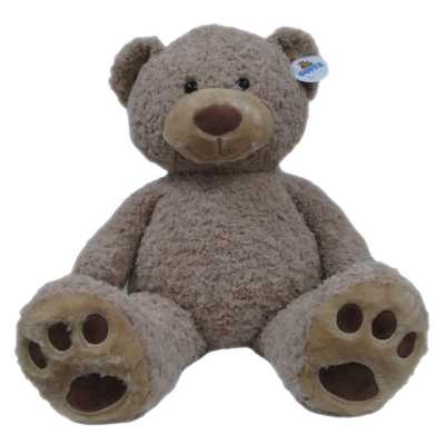 Plush teddy bear sitting upright on a white background