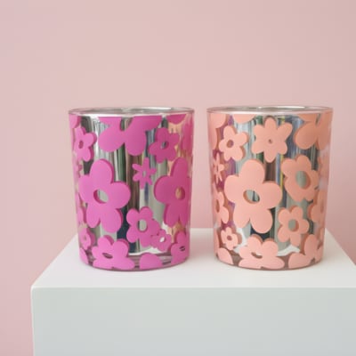 A pair of metallic flowers candles with sunflowers