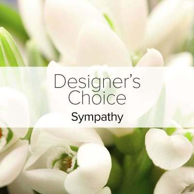 White tulips with a sympathy label