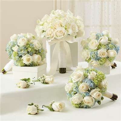 White rose bouquets with pale blue flowers and ribbon wraps
