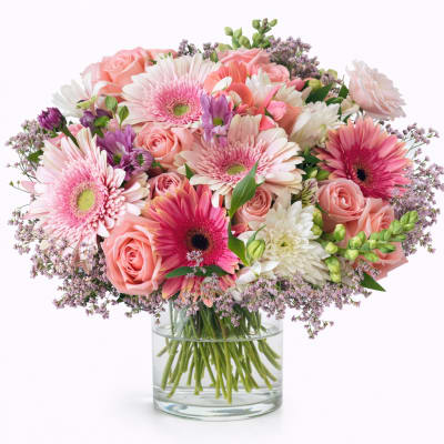 Pink and white mixed bouquet in a clear glass vase