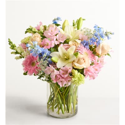 Mixed pastel bouquet in a clear glass vase