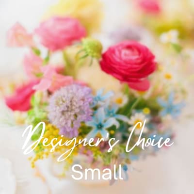 Blurred pastel bouquet with pink, yellow, and blue flowers