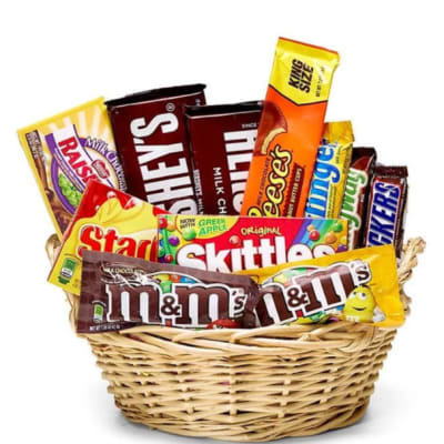 Basket filled with assorted candy bars and chocolate packs
