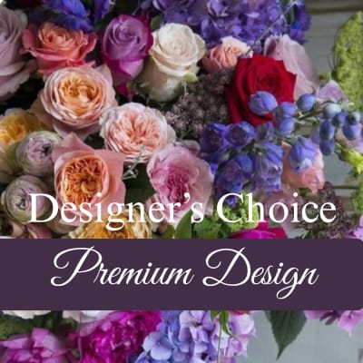 Mixed bouquet of roses and purple flowers with "Designer's Choice" text