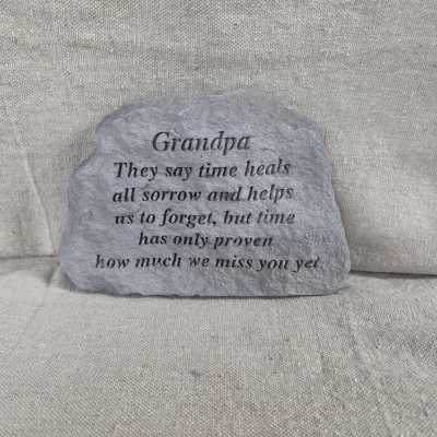 Gray memorial stone engraved with a sentimental message for a grandpa.
