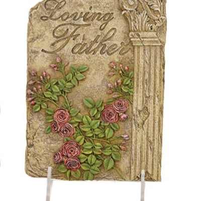 Stone memorial plaque reading Loving Father with carved pink roses and a decorative column