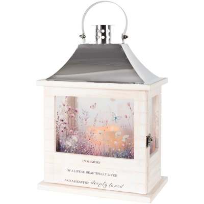 White memorial lantern with floral artwork, butterflies, and an inner candle