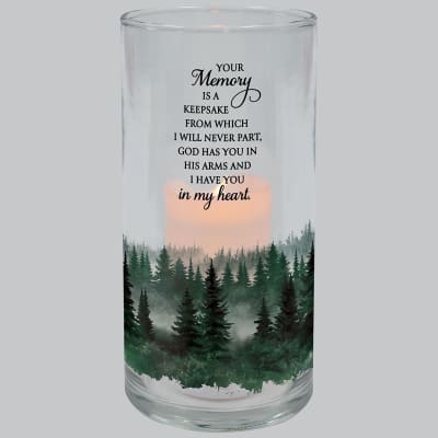 Glass cylinder candle holder with forest design, memorial quote, and lit candle inside