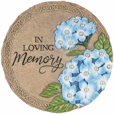 Round stone plaque with blue flowers and the words In Loving Memory.