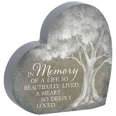 Heart-shaped memorial plaque with white tree illustration and remembrance quote