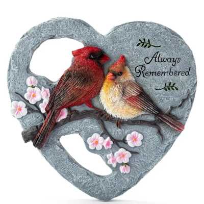 Heart-shaped gray memorial plaque with two cardinals and pink blossoms reading "Always Remembered".