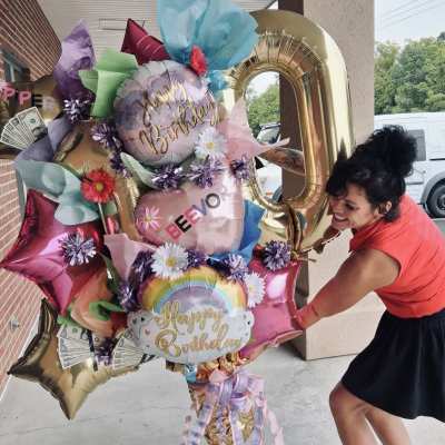 Birthday balloon bouquet with flowers and money accents