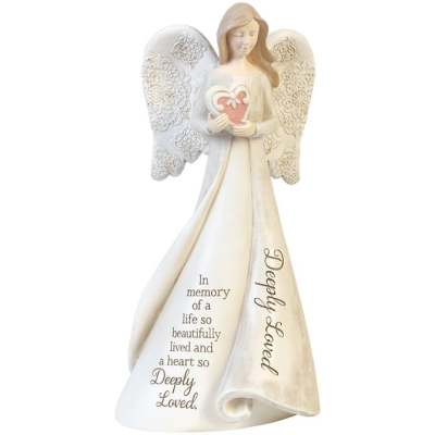 Cream-colored angel figurine holding a pink heart with memorial inscription on the gown
