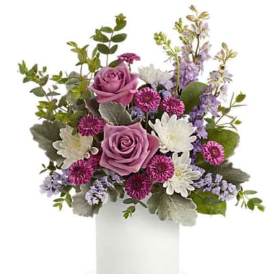 Lavender roses and white daisies in a white vase