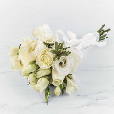 Cream rose and white lisianthus bouquet tied with white ribbon