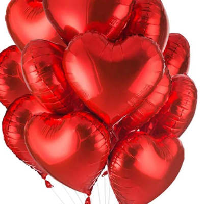 Cluster of red heart-shaped balloons on white background