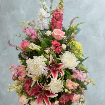 Tall bouquet of pink and white flowers with lilies and roses