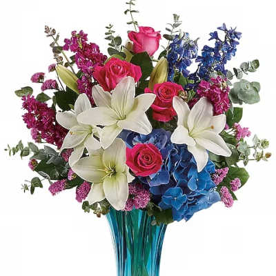 Bouquet of pink roses, white lilies, blue hydrangeas in a blue vase