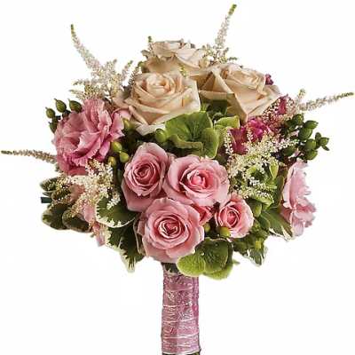 Pink and cream rose bouquet with green accents and a pink wrapped handle