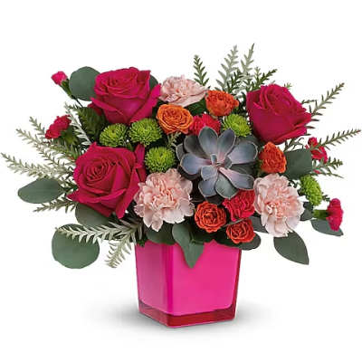 Pink and orange flower arrangement in a magenta vase