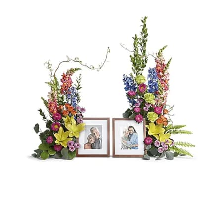 Two floral sprays framing two photo frames